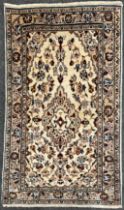 A Central Persian Kashan rug / carpet, hand-knotted in subdued earthy tones, accented in blue,