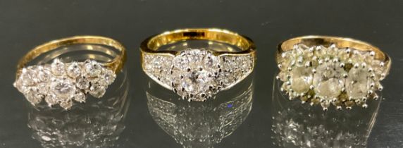 A 9ct gold CZ cluster ring, another, both stamped 375, size Q & R, 6.5g gross; another white stone
