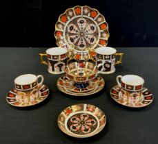 Royal Crown Derby - a pair of 1128 Old Imari pattern coffee cans and saucers, another saucer, a