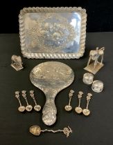 A George V silver embossed dressing table tray, Birmingham 1916, 166g; similar hand mirror, each