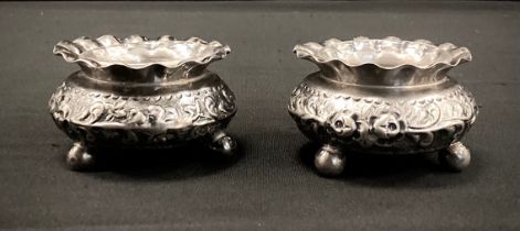 A pair of Victorian silver table salts, clear glass liners, Nathan & Hayes, Birmingham 1887, 86.4g