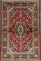 A Central Persian Kashan rug / carpet, hand-knotted with navette-shaped medallion, within a field of