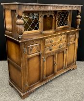 A Stanley Wood elm court cupboard, 138cm high x 141.5cm wide x 47.5cm deep.