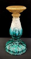 A rococo moulded majolica jardiniere stand, glazed in tones of blue and yellow, 54cm high