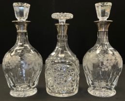 A pair of silver mounted etched glass decanters, incised grapes on vine decoration, London, 1970,