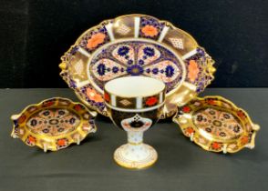 Royal Crown Derby - a 1930s 1128 old Imari oval dish, out swept acorn handles, scrolling feet,