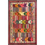 A South West Persian Qashgai Kilim rug, hand-knotted with geometric design in multiple colours,