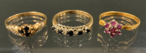 A 9ct gold diamond and sapphire cluster ring, size N, another 9ct gold dress ring, size M, 4g