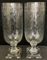 A pair of modern cut glass hurricane lamps, on square base, 40cm high (2)