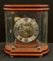 A Franz Hermle part skeleton dial mantel clock, model number number 352-070, the shaped glass case