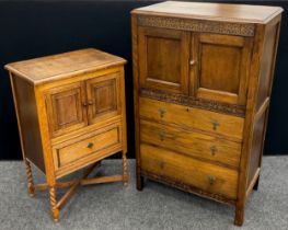 An early 20th century oak side cabinet, pair of small cupboard doors to top, above a single