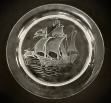 A Lalique glass plate decorated with a three masted ship, engraved signature Lalique France to base,