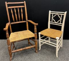 A 19th century Elm spindle-back armchair, and an early 20th century faux-bamboo chair, painted