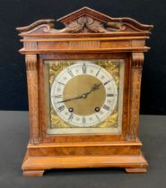 A Lenzkirch Walnut cased Black Forest mantel clock, carved architectural pediment, the brass and