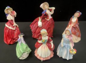 Royal Doulton figures including; ‘Autumn Breezes’ HN1934, ‘Christmas Morn’ HN1992, ‘Paisley Shawl’