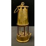 A brass Eccles miner’s lamp,26cm high