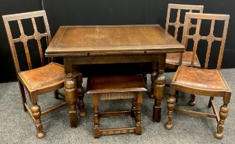 An oak draw-leaf dining table, c.1950, and a set of three oak dining chairs; an oak stool /