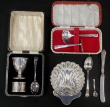 Silver Shell shaped sweet meat dish, London,1904; egg holder, spoon, napkin ring set, Birmingham,