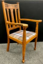 An early 20th century Arts and Crafts style oak armchair, 113cm high x 64cm wide, c.1910.