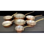 Copper and Brass - seven copper and brass Skillet pans, graduated sizes, from 31cm diameter to