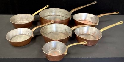 Copper and Brass - seven copper and brass Skillet pans, graduated sizes, from 31cm diameter to