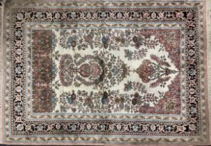 A Persian Kashan silk carpet / rug, knotted with a central field as a stylised floral arbor and