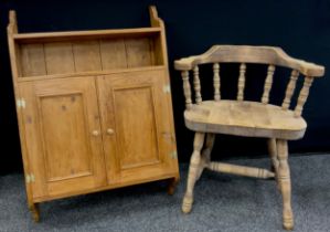 A pine wall mounted cupboard / shelf, and a Smoker’s bow spindle-back chair, (2).