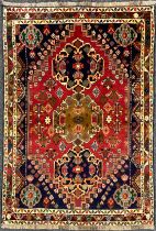 A South West Persian Qashgai rug / carpet, hand-knotted with a central row of three medallions,