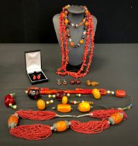 Jewellery - a multi tone amber coloured resin and glass bead necklace, tied leather cord, Oriental