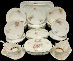 A 20th century dinner service decorated with flowers for six, comprised of two graduated rectangular