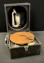 A Vintage Decca portable gramophone, with winding handle and ‘songster’ tin of needles.