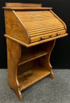 An early 20th century oak tambour top lectern desk, fitted interior, 110cm high x 65cm wide x 46.5cm