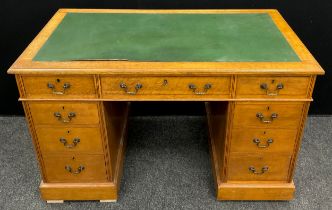 An early 20th century oak pedestal desk, 75.5cm high x 122cm wide x 67.5cm deep.