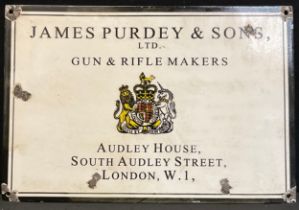 A replica enamel ‘Purdey & Sons’ sign, 38cm x 25cm