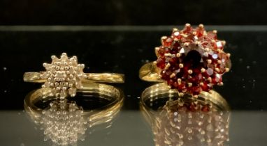 A diamond cluster ring, 9ct gold shank, size Q. 1.7g gross, another garnet, 9ct gold shank, size