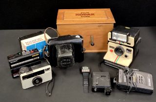 Cameras and Equipment - A Kodak film Tank, Polaroid 1000SE, Kenit Em 2/58 camera, cased, 1980's