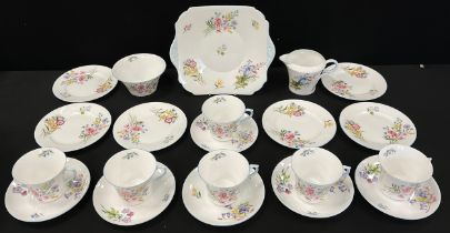 A Shelley ‘Wild flowers’ pattern tea set for six comprised of six tea cups and saucers, conforming