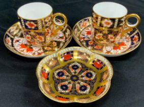 A pair of Royal Crown Derby 2451 ‘Old Imari’ coffee cans and saucers, 1128 trinket tray (3)