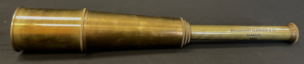 A replica five drawer brass extendable telescope, inscribed ‘Broadhurst Clarkson & Co. London 1942’,