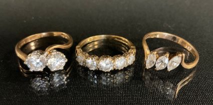 Rings - a 9ct gold cz two stone dress ring, others, 6.8g gross (3)