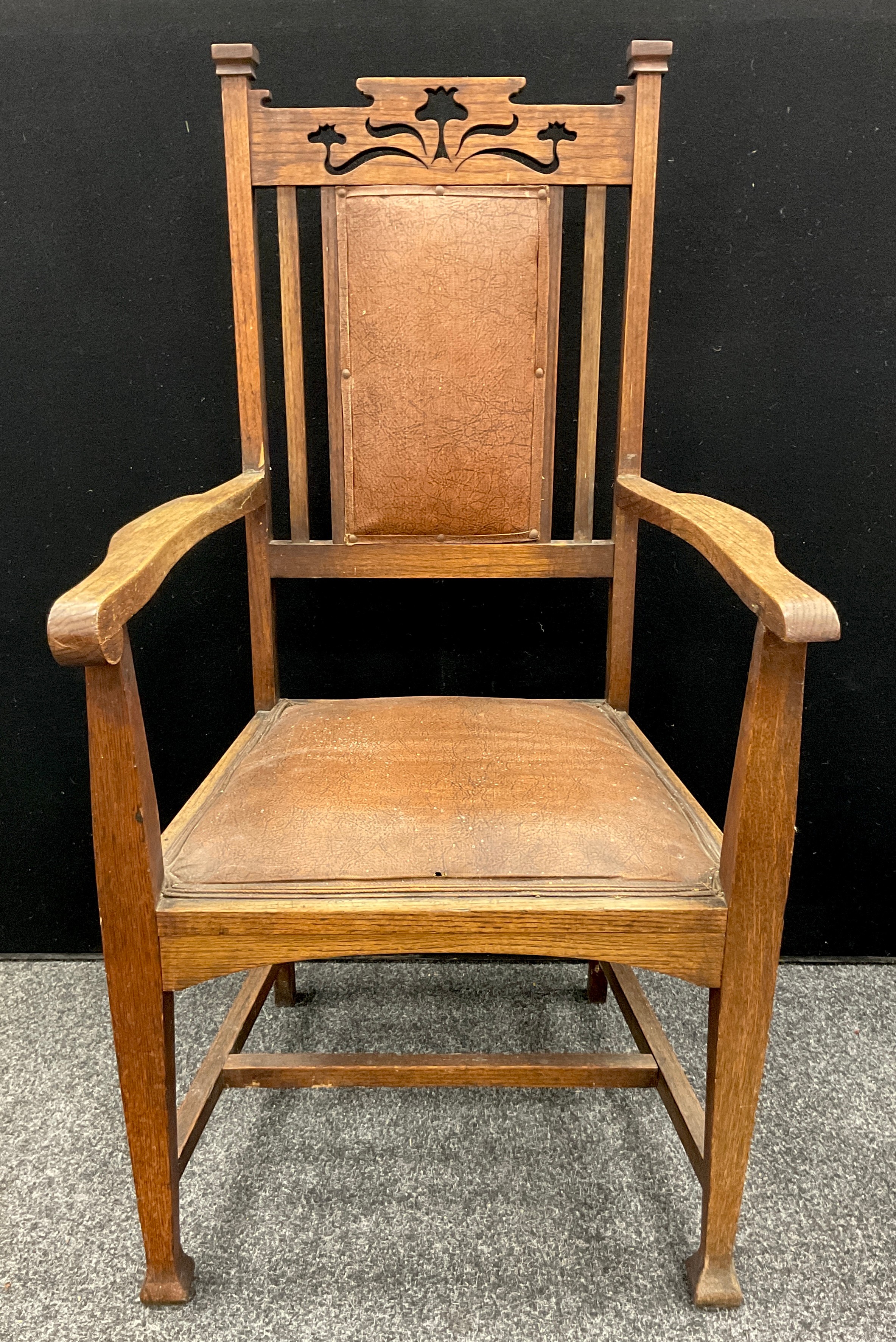 An Arts and Crafts oak armchair, c.1920; an early 20th century oak periodical rack, c.1930 (2) - Image 2 of 3