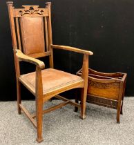 An Arts and Crafts oak armchair, c.1920; an early 20th century oak periodical rack, c.1930 (2)