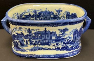 A reproduction blue and white foot bath, with landscape and floral decoration