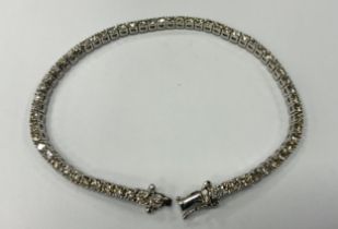 A diamond tennis bracelet, set with sixty two round brilliant cut diamonds, total estimated