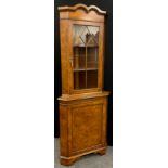 A George III style reproduction burr walnut corner cabinet, 197.5cm high x 75cm wide.
