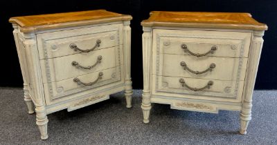 A pair of Empire style bedside cabinets, shaped tops, above three short drawers, turned and fluted