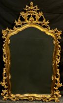 An ornate 18th century style faux gilt wood mirror, 142cm high x 90cm wide.