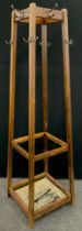 A mid-20th century school or office hat and coat stand, 173cm high.