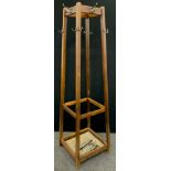 A mid-20th century school or office hat and coat stand, 173cm high.