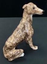 A Winstanley pottery model of a Seated Brindle Greyhound, numbered 5, 25.5cms high